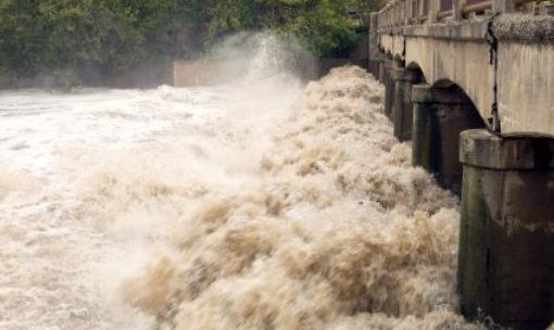 River in flood carrying vast quantities of silt - iStockPhoto